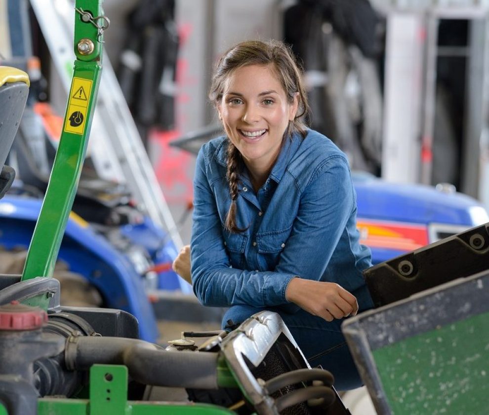 smiling woman in a mechanical workshop